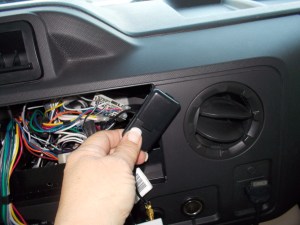 Locate the heavy black cable with a small black box on the other end.